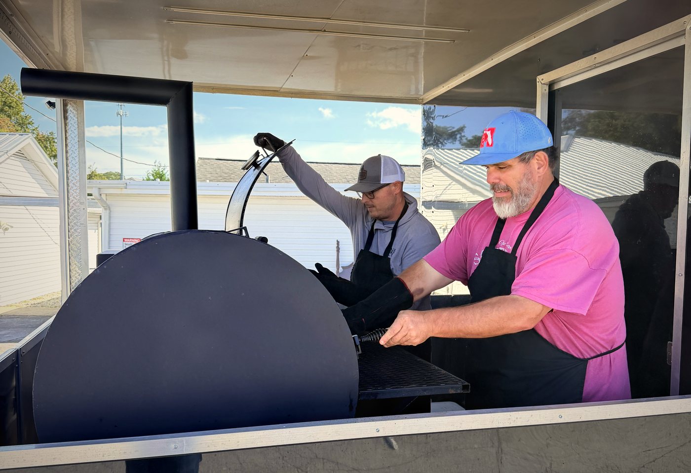 The Coach's Corner crew working the smoker at the truck